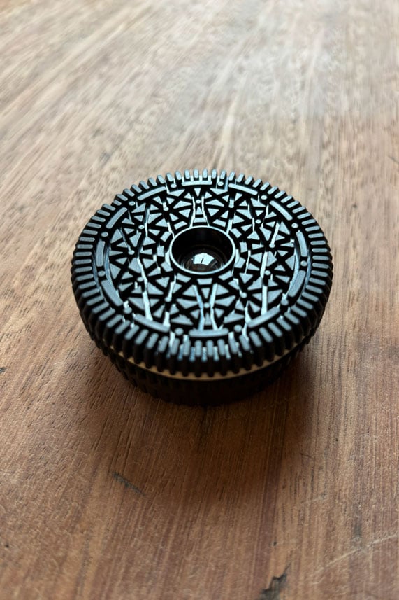 A lens that looks like an Oreo biscuit